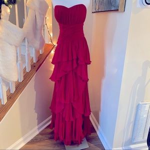 Dalia Macphee red layered ruffled gown.
